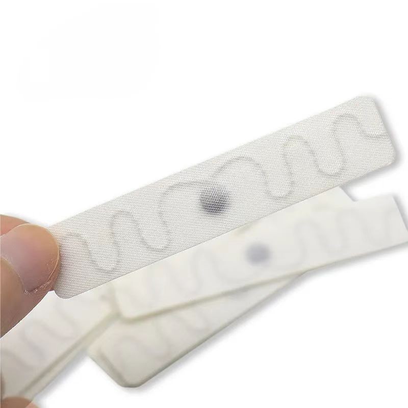 Étiquette de linge lavable Étiquette de lavage de tissu RFID UHF Étiquette de vêtement
