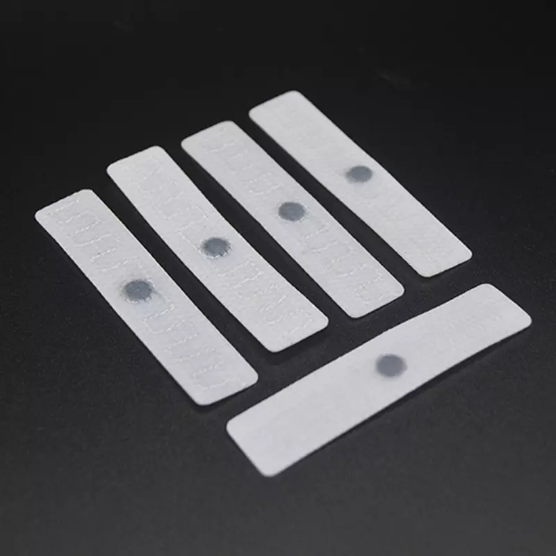 Étiquette de blanchisserie intelligente RFID en tissu flexible pour la gestion des stocks