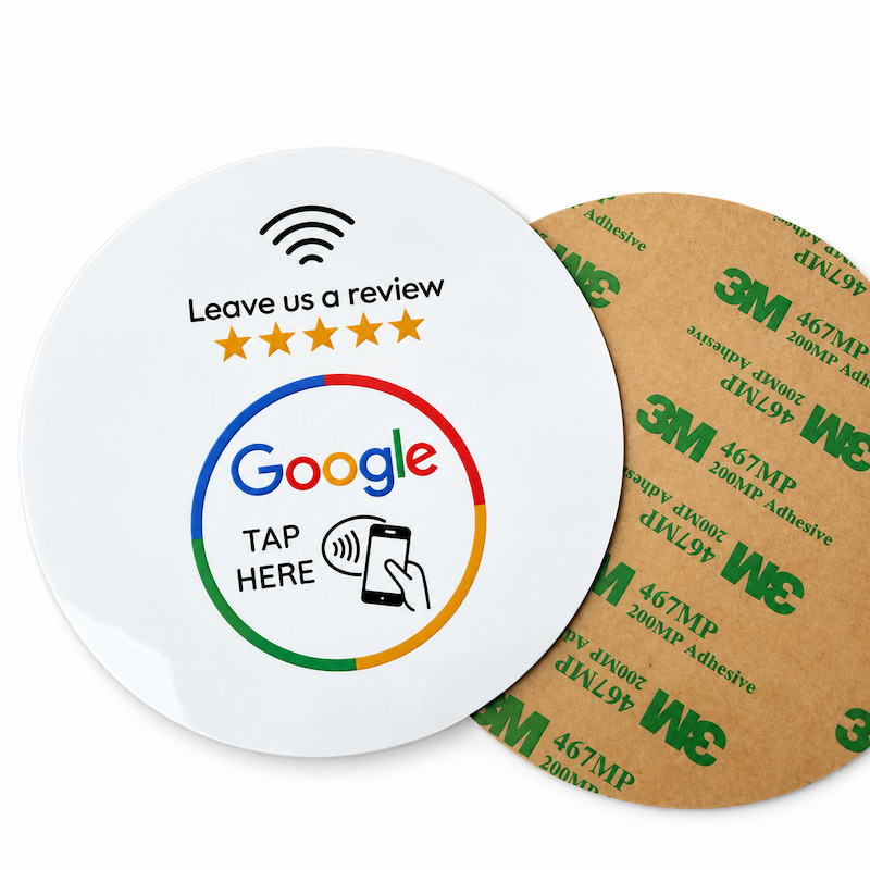 White NFC Google review window sticker on a café glass door